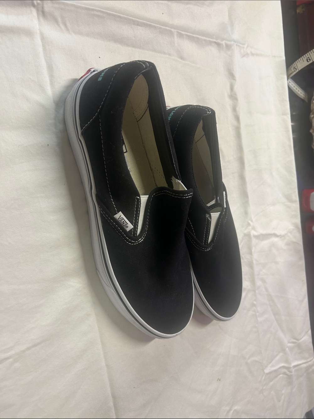 Vans Black and White Slip-On Canvas Sneakers